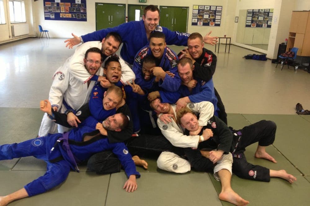 Early Kingston Jiu Jitsu members piled together after a Monday night class