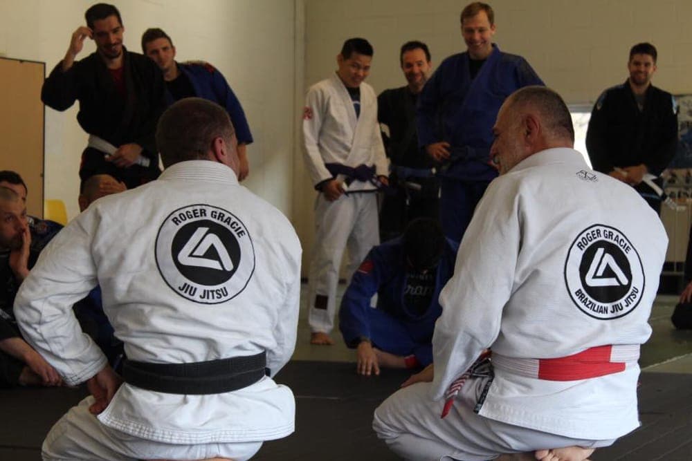 Marc Barton and Mauricio Gomes in Roger Gracie Jiu Jitsu gis at a seminar